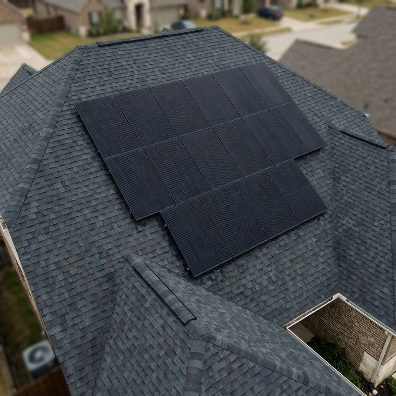 Black solar panels on hip roof residential home in Tampa, Florida
